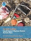 Cover page of accomplishments report, showing debris on a beach along Lake Erie