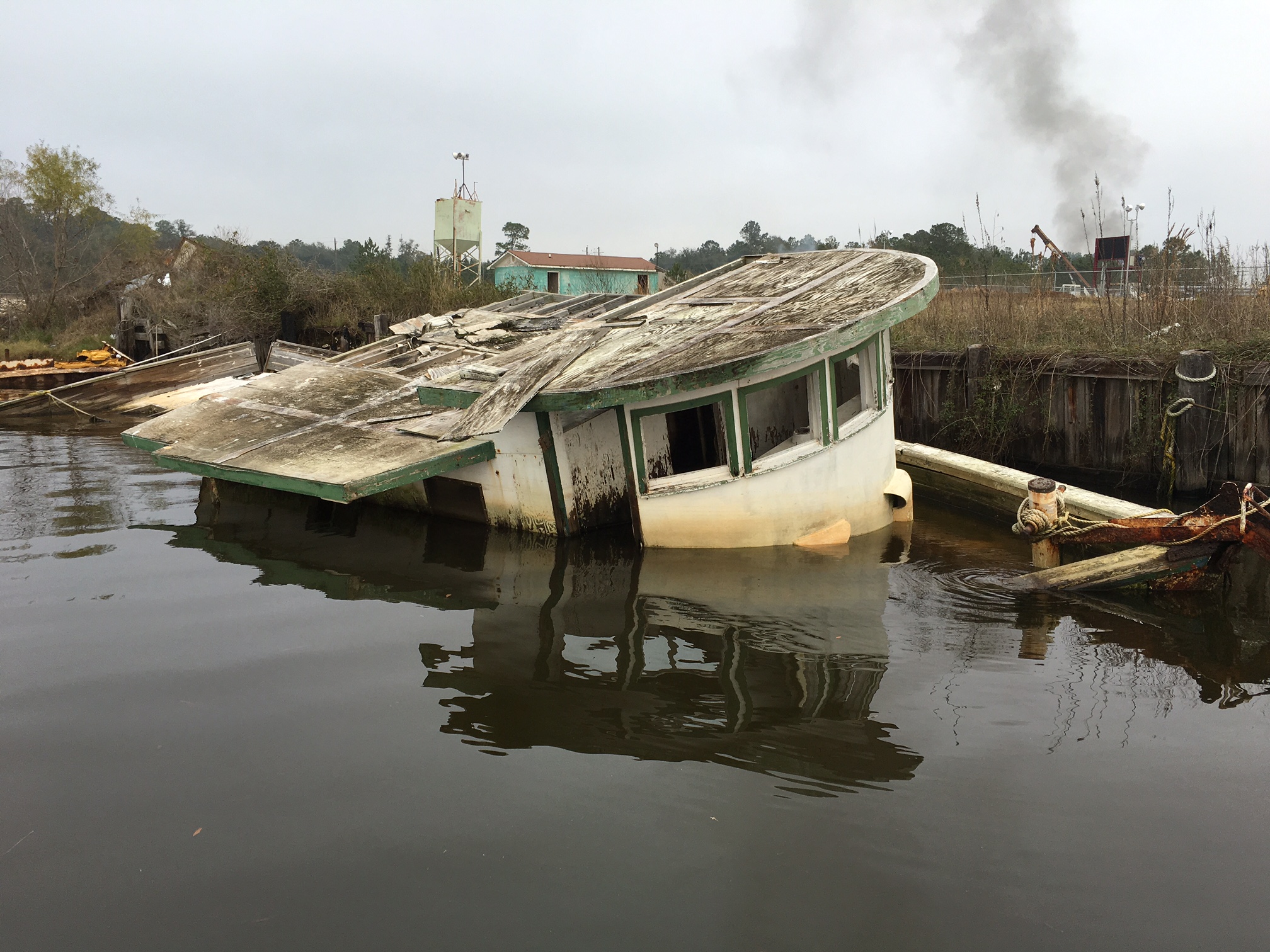 sunken shrimping boat next to port